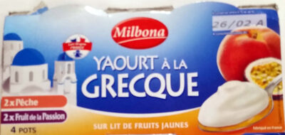 Foto de Yaourt à la grecque sur lit de fruits jaunes
