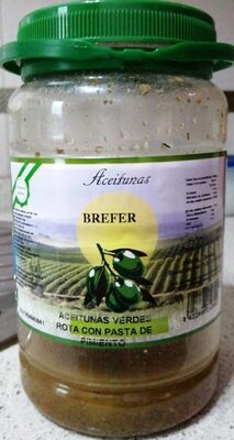 Foto de Aceitunas verdes rota con pasta de pimiento
