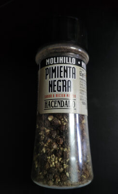 Foto de Pimienta negra en grano molinillo